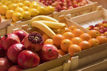 Counter with fruit in wooden boxes, background