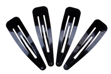 Four black metal hair-slides isolated on white background