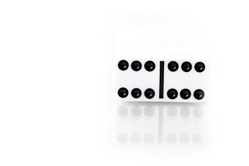 Domino effect - row of white dominoes on white background