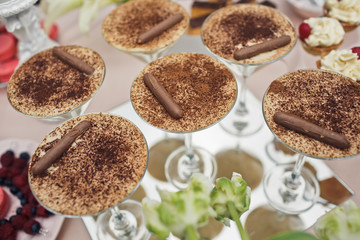 Tasty chocolate desserts served in cocktail glasses