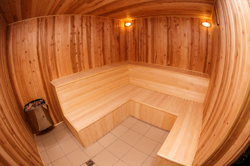 Fototapeta na wymiar Empty wooden sauna fish-eye view