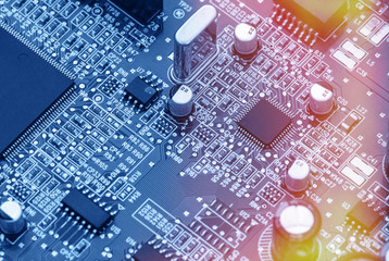 Circuit board with electronic components. Computer and networking communication technology concept. Toned image.