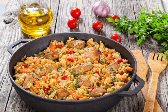 Homemade prepared paella with meat, pepper, vegetables