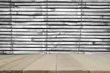Old wooden planks with lath made from bamboo for background.