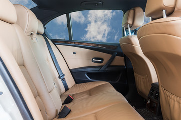 Car interior detail on the sky background