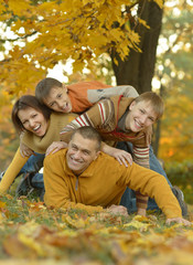Fototapeta premium Happy family in autumn forest