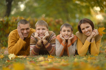 Fototapeta premium Happy family in autumn forest