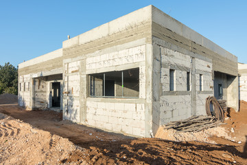 Brick and concrete house under construction