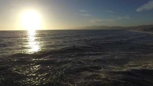 Ocean waves crashing. Marina del Rey, California during sunset