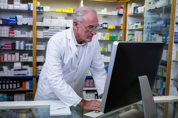 Pharmacist using computer