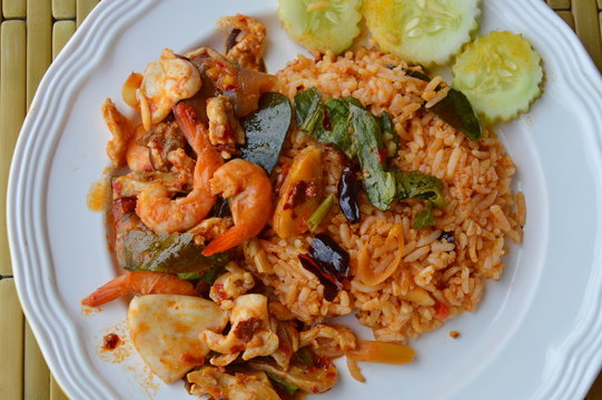 spicy fried rice with seafood and herb on dish