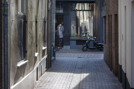 Fototapeta Alley and street with fashion store