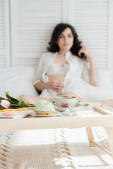 Obraz na płótnie Canvas Woman having Breakfast in bed