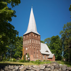 Fototapeta na wymiar Village church of Iwięcino with its leaning tower