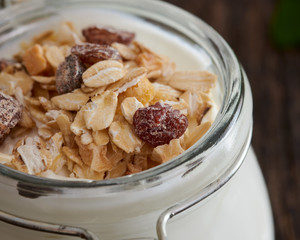 Greek yogurt with cereal on a wooden table