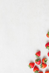 Fresh strawberry on white wooden table for background.