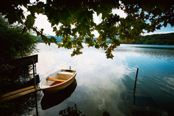 Naklejka na ściany i meble Peaceful atmosphere lake,boats and pier