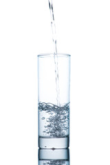 Drinking water is poured into a glass