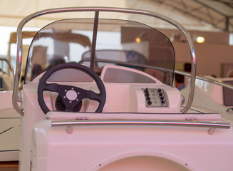 Instrument panel and steering wheel of a motor boat cockpit (yacht control bridge)