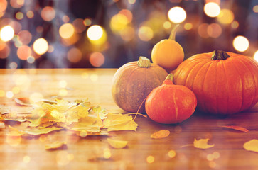close up of halloween pumpkins on wooden table