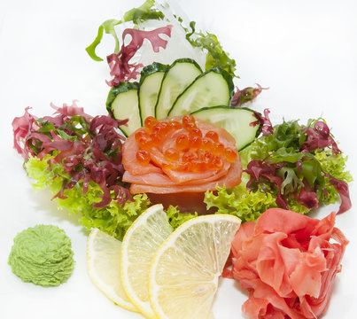 Japanese cuisine sashimi with vegetables and fish in a restaurant