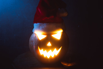 Jack-o ' - lantern scary shining eyes in the darkness.