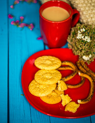 Breakfast on a blue wooden background, Cup of latte with cookies