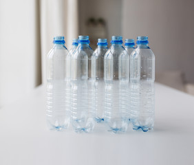 close up of empty used plastic bottles on table
