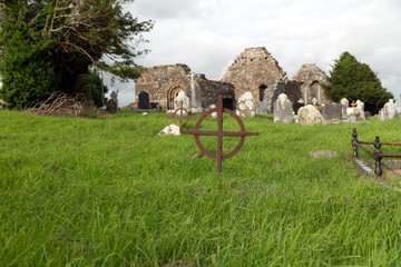 old grave cross on celtic cemetery in ireland