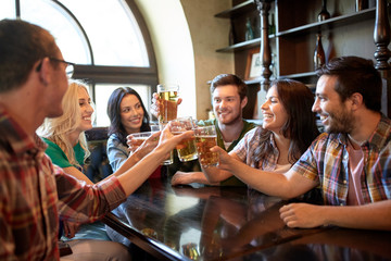 happy friends drinking beer at bar or pub