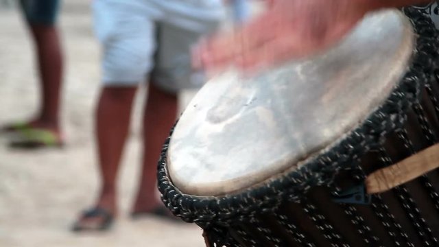 man playing on drum 