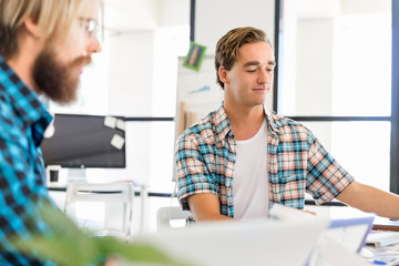 Two office workers at the desk