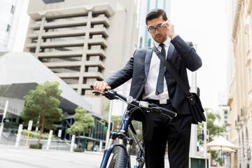 Young businessmen with a bike