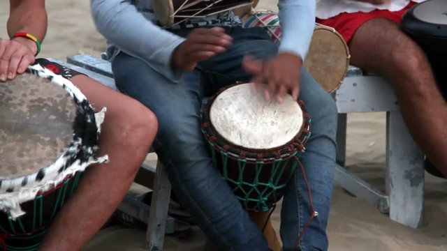 man playing on drum 