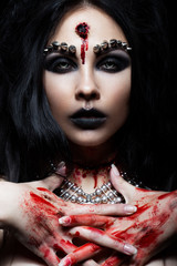 Demon girl with a bullet in the head and her throat cut. An image for Halloween. Photos shot in...