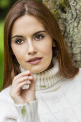 Naklejka premium Beautiful Thoughtful Young Woman With Red Hair