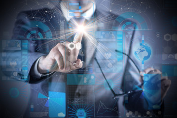 Businessman pressing buttons in futuristic concept