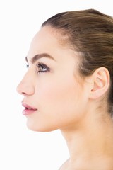 Side view of beautiful woman posing against white background