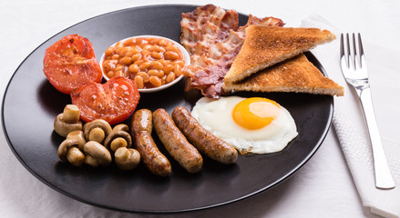 full english breakfast on black plate