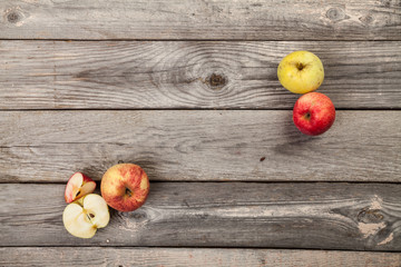 Apples on gray old planks wood table