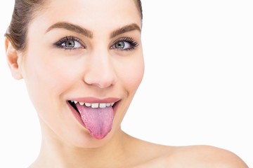 Portrait of beautiful woman posing against white background