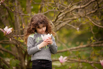 Little girl playing in the garden