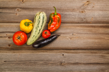 Vegetables on brown old planks wood table