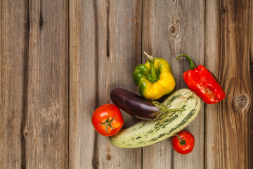 Vegetables on brown old planks wood table