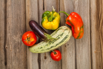 Vegetables on brown old planks wood table