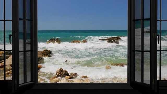 Looking out through the window at the sea in summer