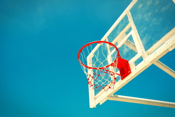 Basketball hoop on a blue sky,color filter