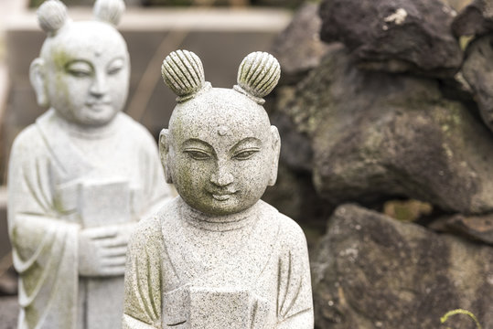 Two stone Asian statue on the Jeju island in South Korea