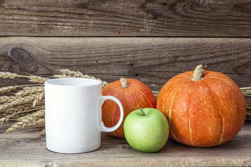 White coffee mug with pumpkins, green  apple and ears of wheat o