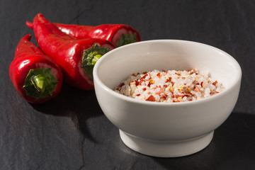 Red chili on stone table background. spices in bowl